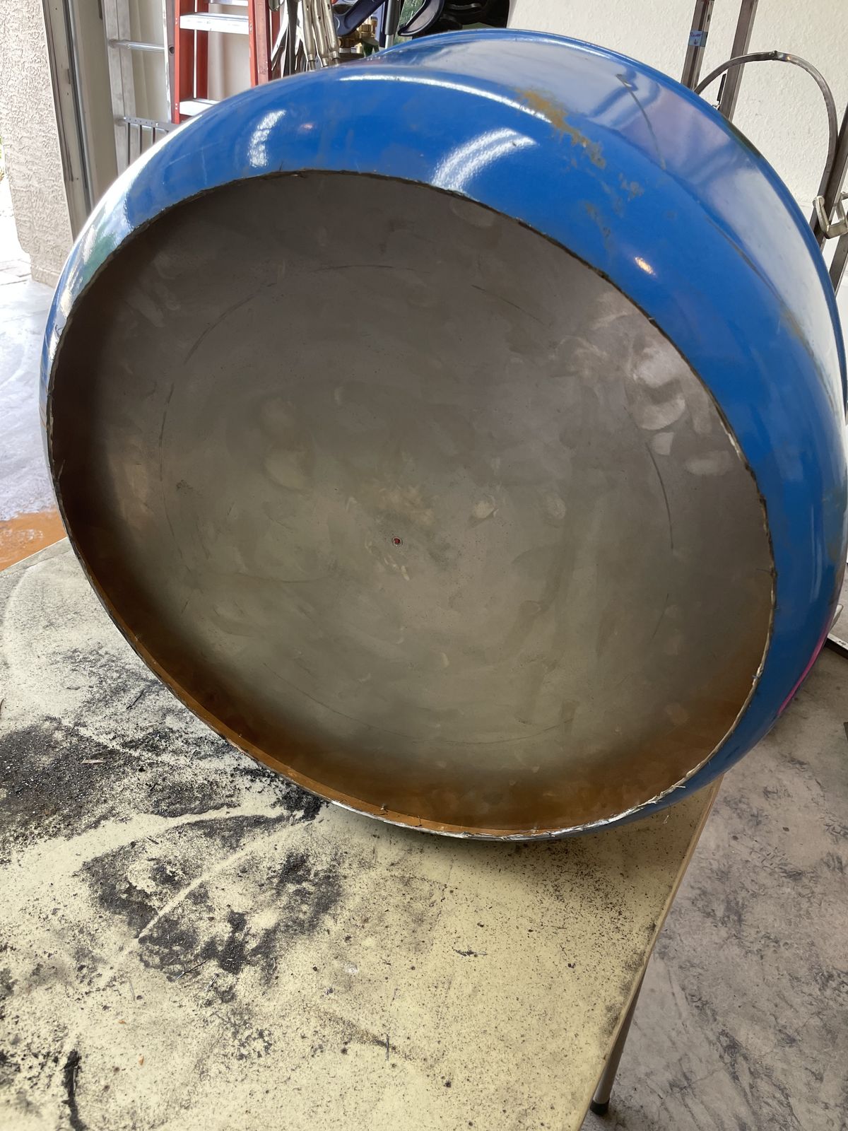 Face dished and fitted into the drum ring.