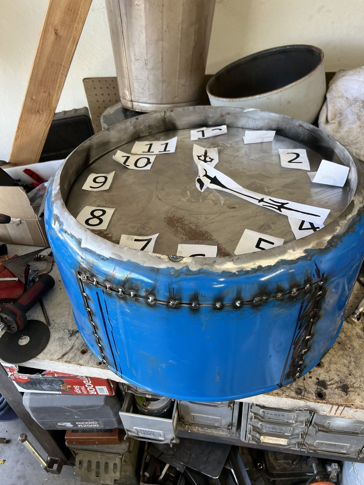 Laying out the numerals before anything is fixed in place.