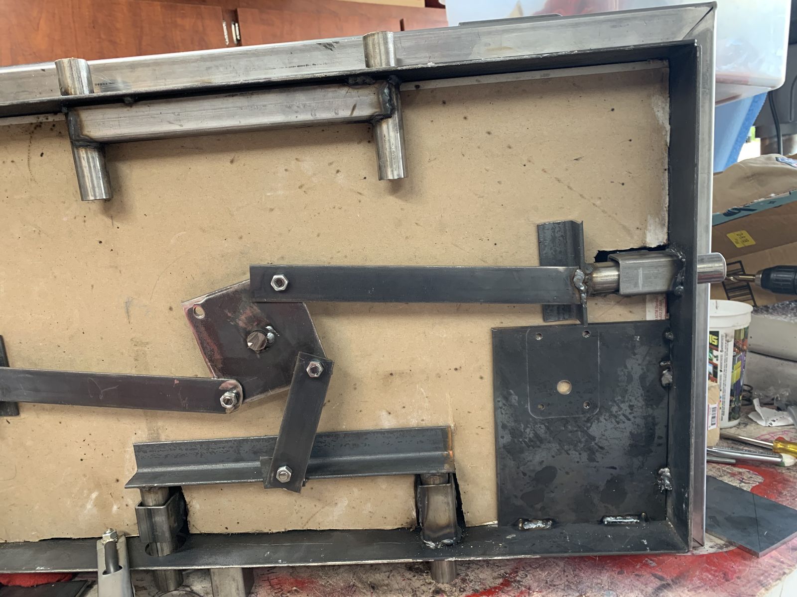 Door linkage: the rotating plate drives the bolts.