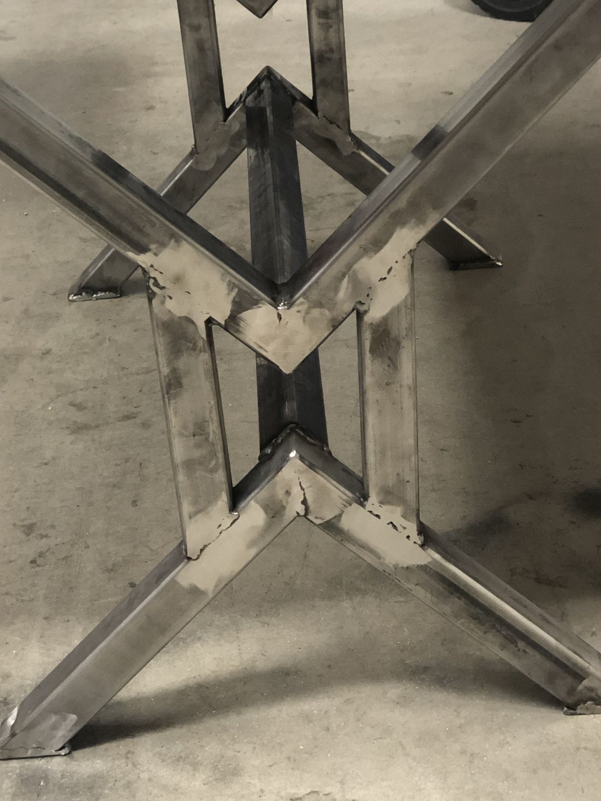 Detail of the welded joint where the legs cross.